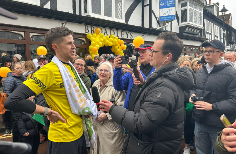 Mims Davies MP celebrates in East Grinstead with James Cooper who ran a marathon a day for charity