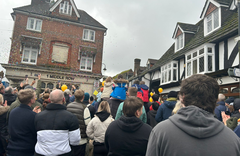 Mims Davies MP celebrates in East Grinstead with James Cooper who ran a marathon a day for charity