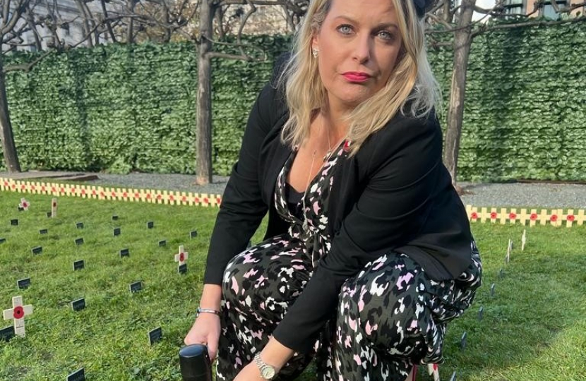 Mims Davies MP lays a Remembrance Cross in the Royal British Legion Constituency Garden of Remembrance at the Houses of Parliament